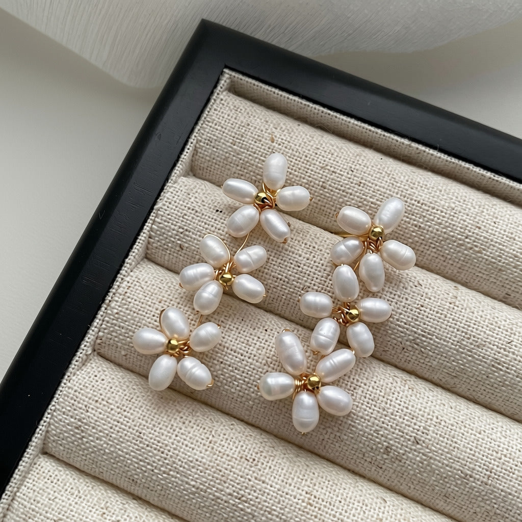 Pearl Flower Drop Earrings — cascade of three hand-strung pearl daisies