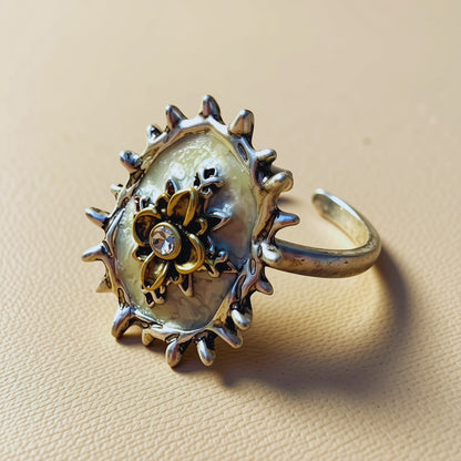 Gilded Bloom Halo Ring — ivory halo ring with gilded floral centrepiece and crystal accent