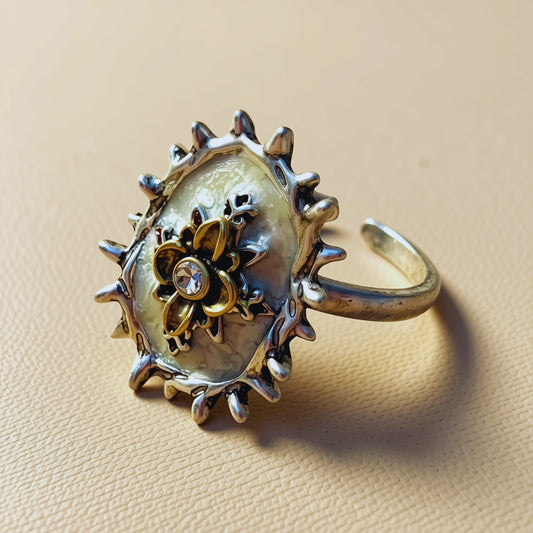 Gilded Bloom Halo Ring — ivory halo ring with gilded floral centrepiece and crystal accent