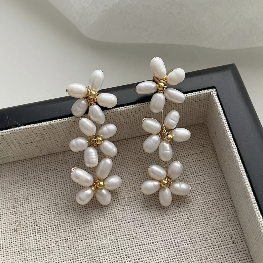Pearl Flower Drop Earrings — cascade of three hand-strung pearl daisies