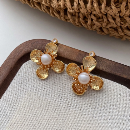 Trèfle Pearl Studs — hand-textured gold petal bloom with freshwater pearl centre